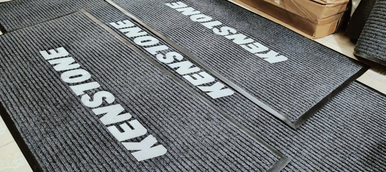 in thêu logo thảm chùi chân